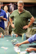Mike McClain watches the board as his pocket aces hold up to eliminate Lee Markholt, who had pocket queens.