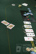 Lee Markholt was all in with pocket queens against Mike McClain's pocket aces. Markholt turned a queen, but McClain had flopped an ace.