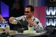 David "The Dragon" Pham tries to pocket a wad of cash at the final table of the Legends of Poker