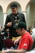 Phil Hellmuth (standing) checks in with fellow Shooting Star Mike Matusow after his elimination on Day 1b of the WPT Bay 101 Shooting Star Tournament