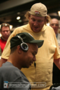 Gavin Smith (standing) checks in with Phil Ivey on Day 3 of the WPT Reno World Poker Challenge