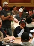 Ali Nejad (standing) checks in with Daniel Negreanu on Day 1b of the WPT World Championship