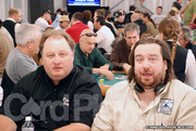 Greg Raymer and Todd Brunson get a bit of a scare in the Poker Pavilion on Day 1 of Event 9 from the high winds in Las Vegas