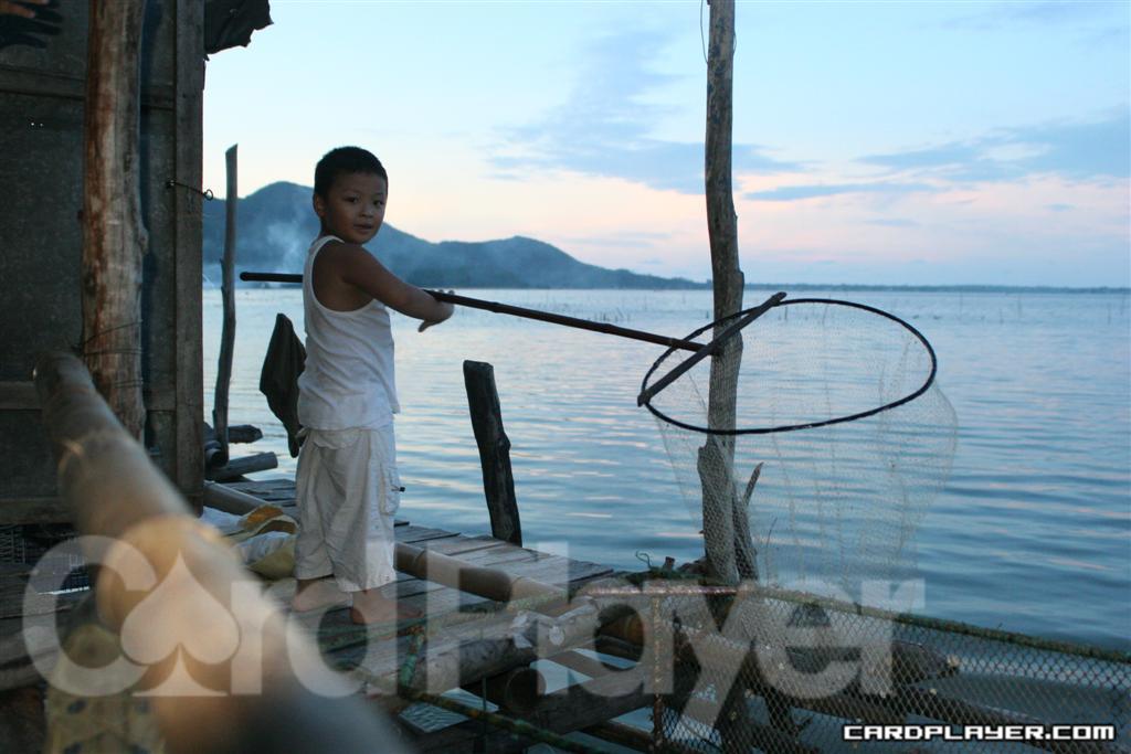 John's Adopted Son Minh Fishing at the Water House
