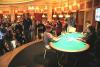 John Luu (seated, left) faces off against Mack Lee (seated, right) when it's three-handed in the $2,000 no-limit hold'em event at Bellagio's Five-Star World Poker Classic. Jean Robert Bellande (standing, left) watches from the side with the crowd.