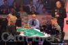 Jack McClelland (standing, right) announces the action as the final three players battle for the title at the final table of the 2005 WPT World Championship.