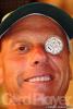Allan Boston showing off his personilized lucky chip, that displays his secrets to poker sucess.