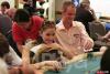 Lily "Mrs. Grinder" Elviro (left) gets a massage to ease the stress of sitting out of position next to Allen Cunningham on Day 1B of the WPT Legends of Poker at the Bicycle Casino in Los Angeles