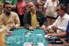 After a flop of 9-7-6, James McCrink (center) is all in with pocket tens against the pocket kings of Derek Payne (right). Matt Keikoan (left) watches the action. McCrink would catch a ten on the river to stay alive and double up in chips on day two of the