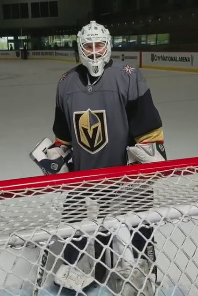 Negreanu trying on goalie pads out on the ice